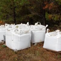 One-ton super sacks filled with crushed oxidized graphitic schist, from the Coosa Graphite Project resource area, in preparation for the pilot-plant study